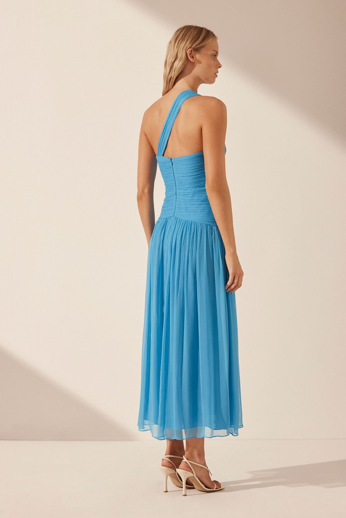 One-shoulder aqua green dress in lurex and crêpe with bow detail